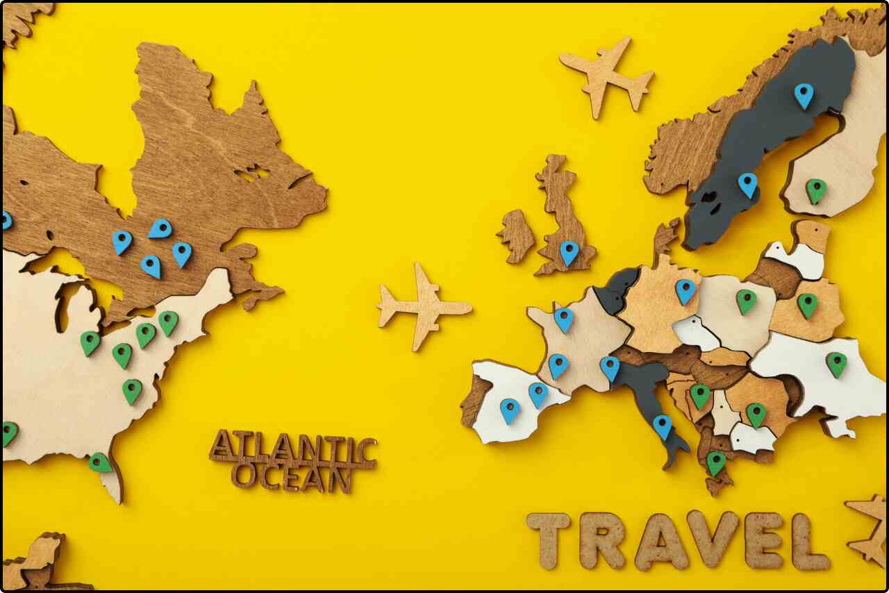 The travel icons such as an airplane representing worldwide adventure in yellow background